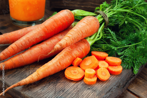 Carrots on wooden table.