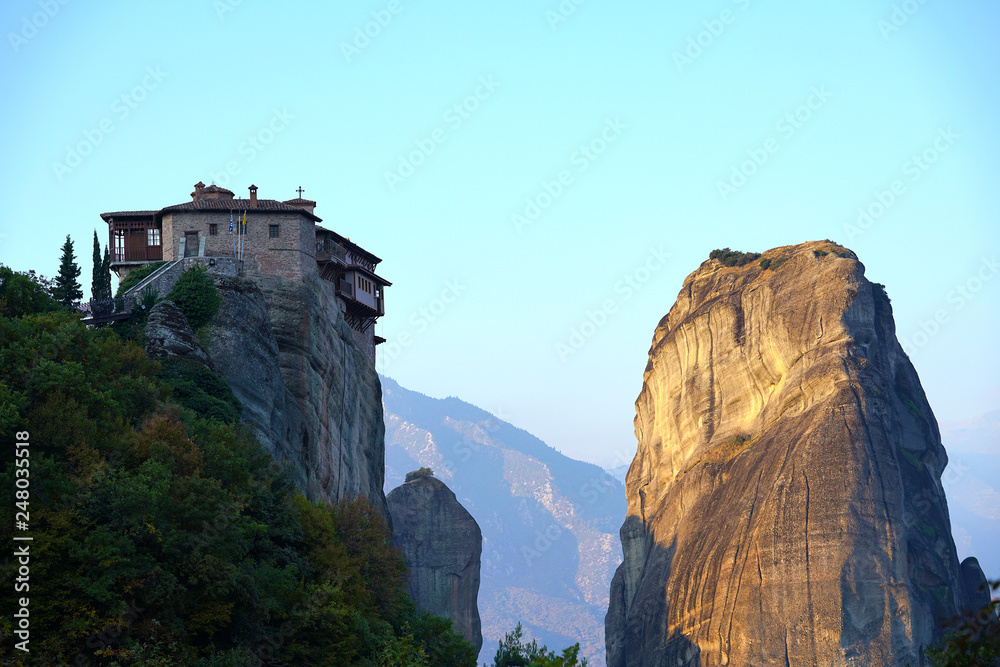 view of Meteora with its monastery and rock formations