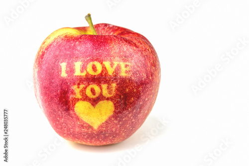 Apple with text I LOVE YOU on white background