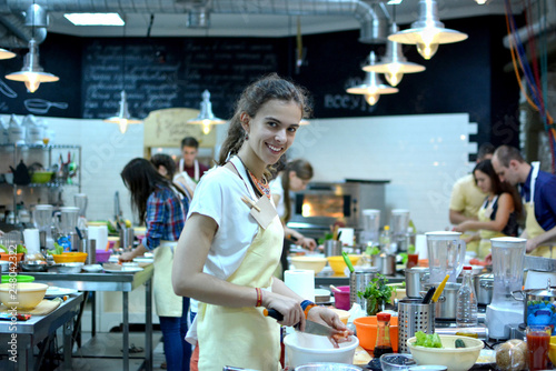 Cooking class. young happy friends in the kitchen
