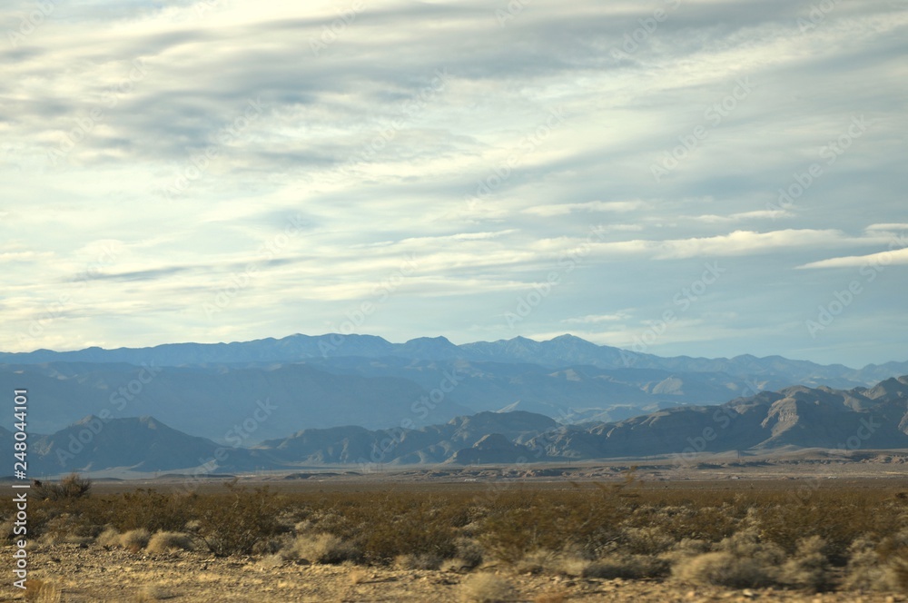 Desert landscape with distant mountain range