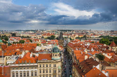 Panorama of Prague Old Town with red roofs , famous Charles bridge and Vltava river, Czech Republic.