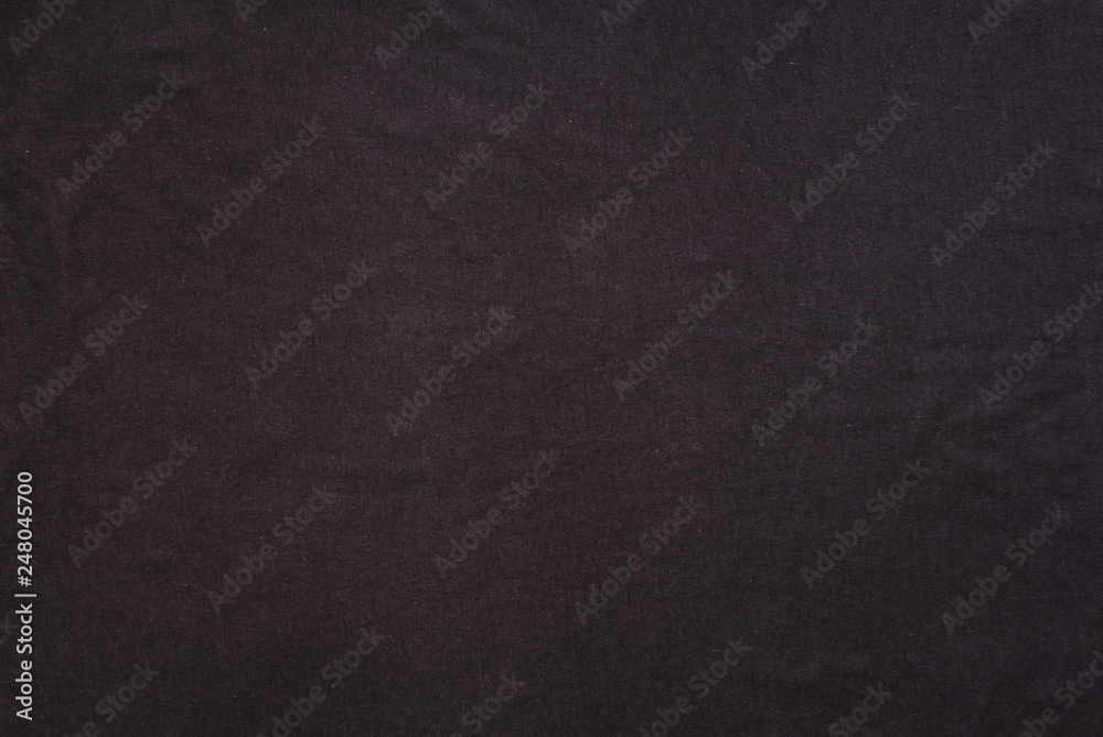Old t-shirt texture, dark blue stretch fabric background. Analog photo simulation Old t-shirt texture, dark blue stretch fabric background. Analog photo simulation