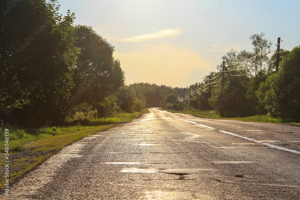 Fototapeta premium Broken road at sunset