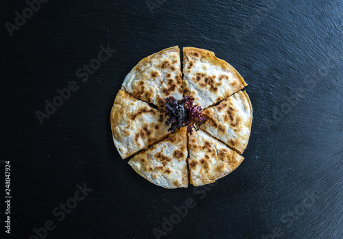 Traditional Turkish Borek Patty Pastry Food isolated on dark background.