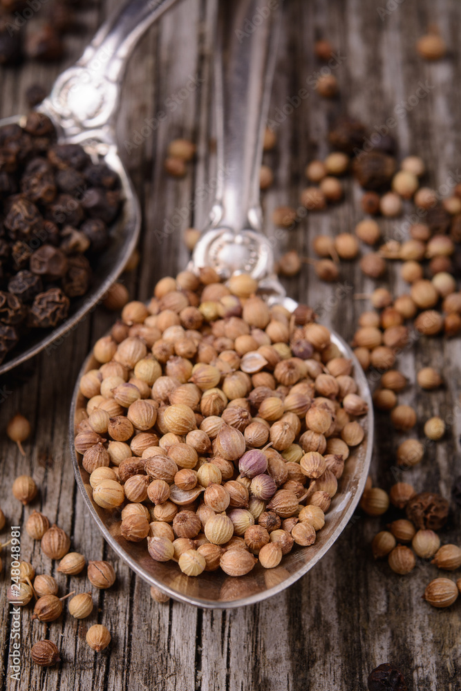 Aromatic spices –white peppers on wooden table. View from above Aromatic spices –white peppers on wooden table. View from above