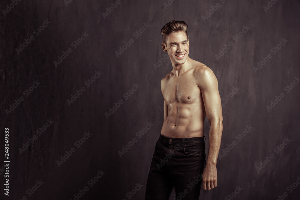 Naklejka premium Joyful nice man standing without a t shirt