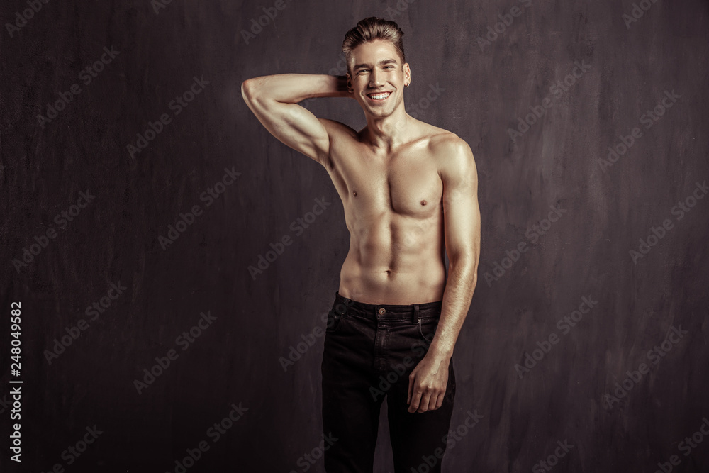 Fototapeta premium Happy nice blonde man touching his head