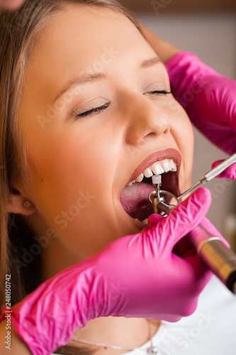 blonde patient girl at the dentist