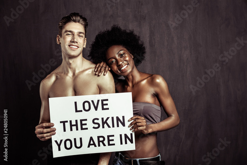 Positive multiethnic couple showing their positive emotions