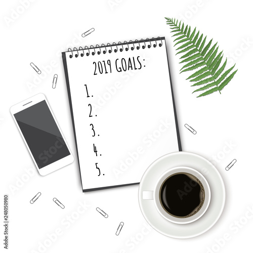 Notebook with wish list on white rustic table  flat lay style. Planning concept.