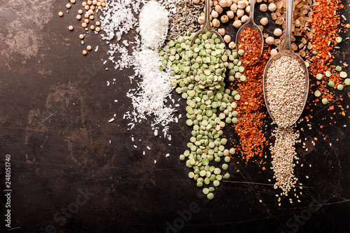 Spices and legumes on black background photo