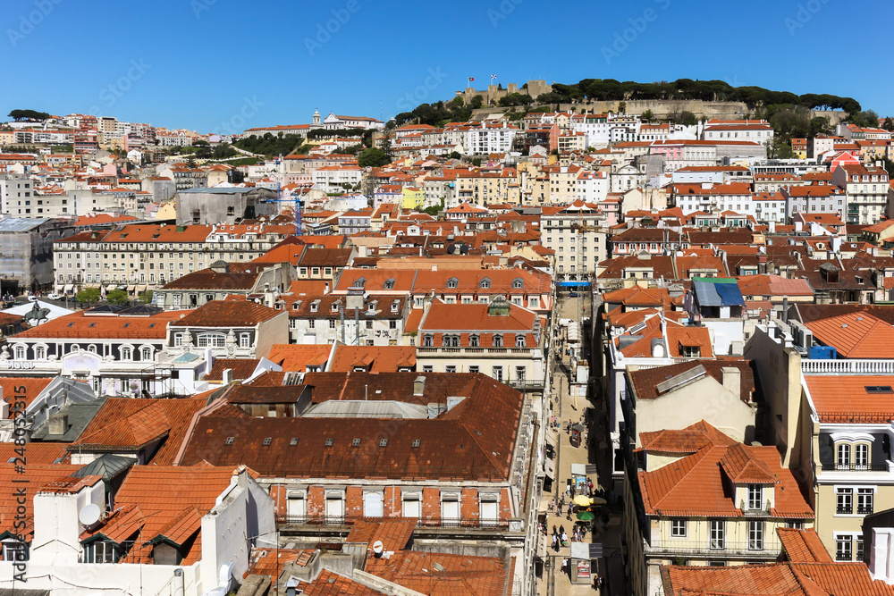 City of lisbon from the top. Roofs of ancient tiles cover the city.