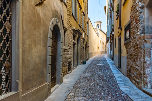 Beautiful Old narrow street of small medieval city Citta Alta, perspective of street in Bergamo, Italy