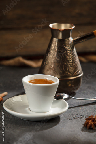 Coffee cup and saucer wooden background