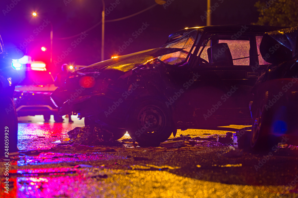 Night road car accident. Car crash in police lights. Stock Photo