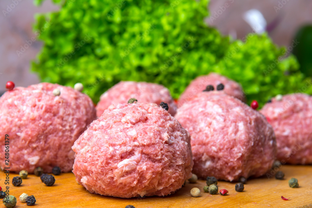 raw mince patties in a cooking . cutlets are prepared for cutting board