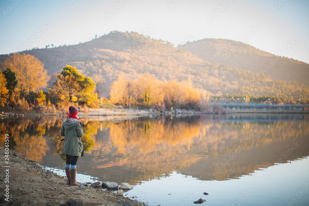 young woman looking lake landscape young woman looking lake landscape
