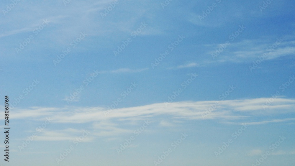 Beautiful blue sky and white cloud background. The  weather is bright.