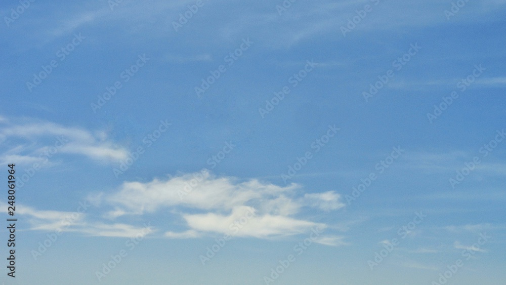 Beautiful blue sky and white cloud background. The  weather is bright.