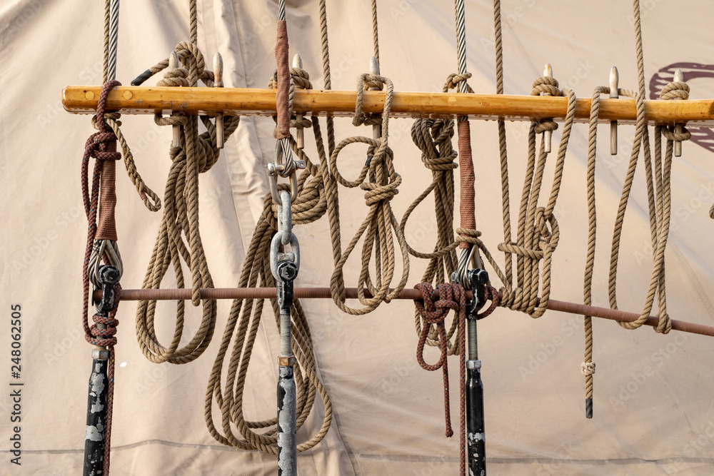 Ropes suspended on stays on the deck of a sailing ship. Accessories needed for sailing. Ropes suspended on stays on the deck of a sailing ship. Accessories needed for sailing.