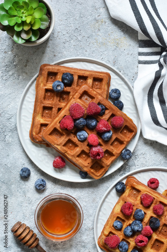 Belgian waffles on a kitchen concrete table. View from above.