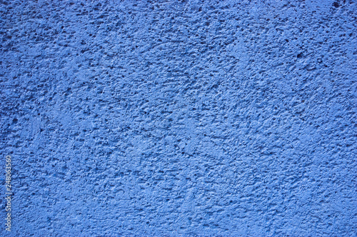 Blue painted sandstone wall. 
