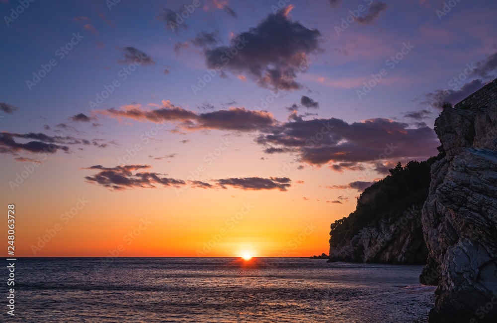 Beautiful sunset over the cliffs in Petrovac