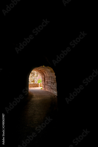 Dark tunnel in the seaside rocky cliffs near Petrovac