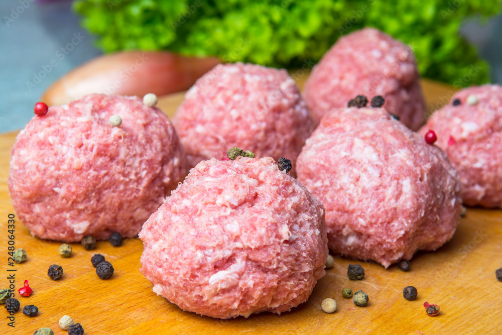 raw mince patties in a cooking . cutlets are prepared for cutting board