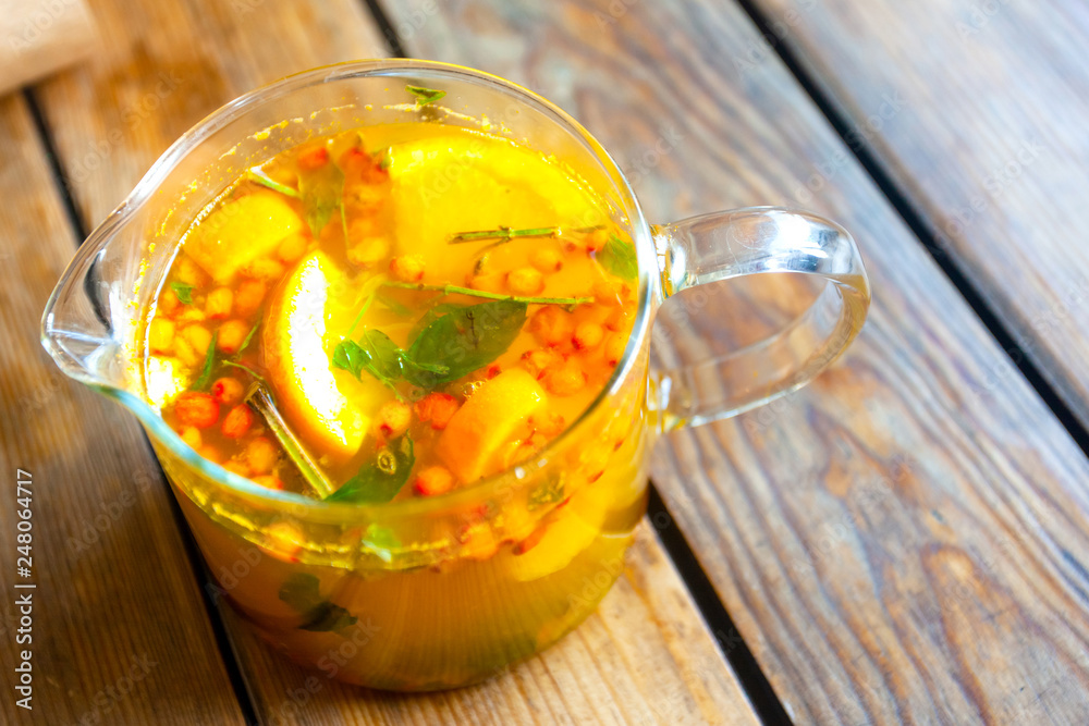 glass teapot with orange sea buckthorn fruit tea glass teapot with orange sea buckthorn fruit tea