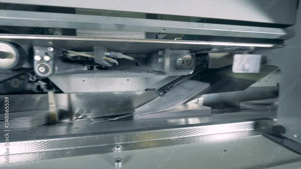Printing office machines working with paper, close up. Printing office machines working with paper, close up.