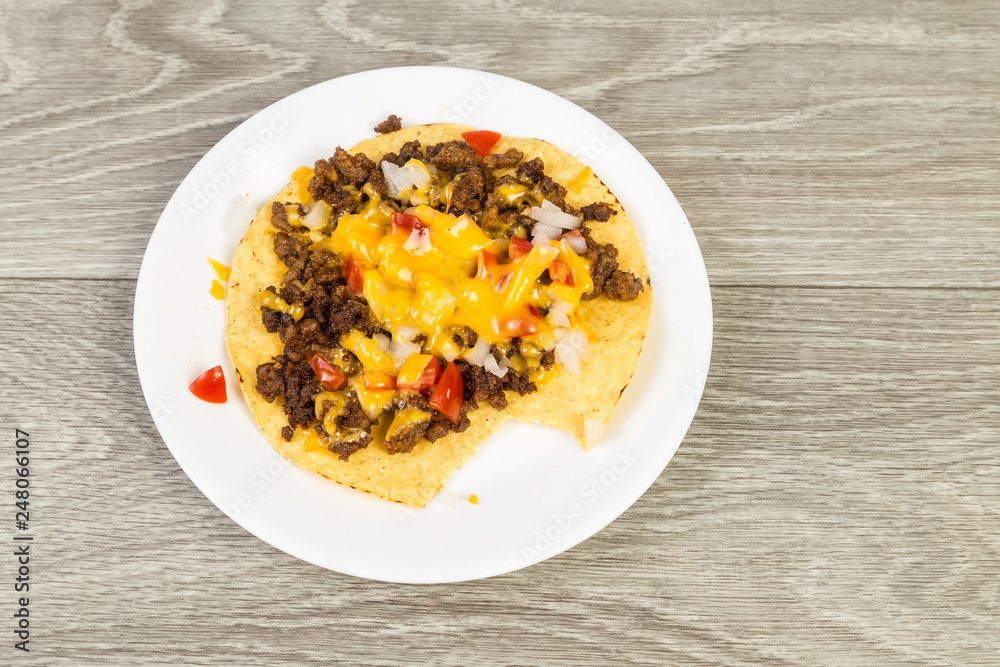 Spicy Beef Tostados on Corn Tortilla with Cheese and Salsa Spicy Beef Tostados on Corn Tortilla with Cheese and Salsa
