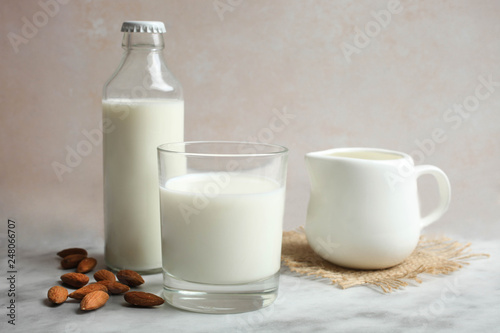 Milk in glass bottle and in glass