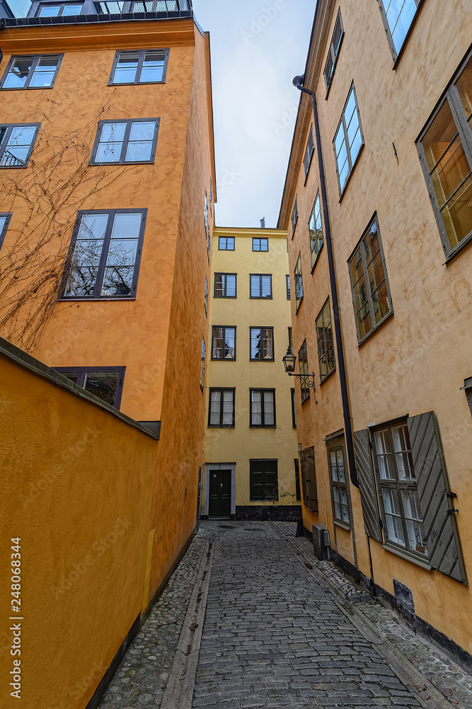 Sweden quaint cobblestone street in picturesque Gamla Stan, Stockholm's oldest neighborhood. Sweden quaint cobblestone street in picturesque Gamla Stan, Stockholm's oldest neighborhood.