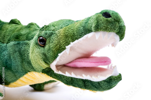 фотографія Green soft stuffed toy Crocodile isolated on white background.
