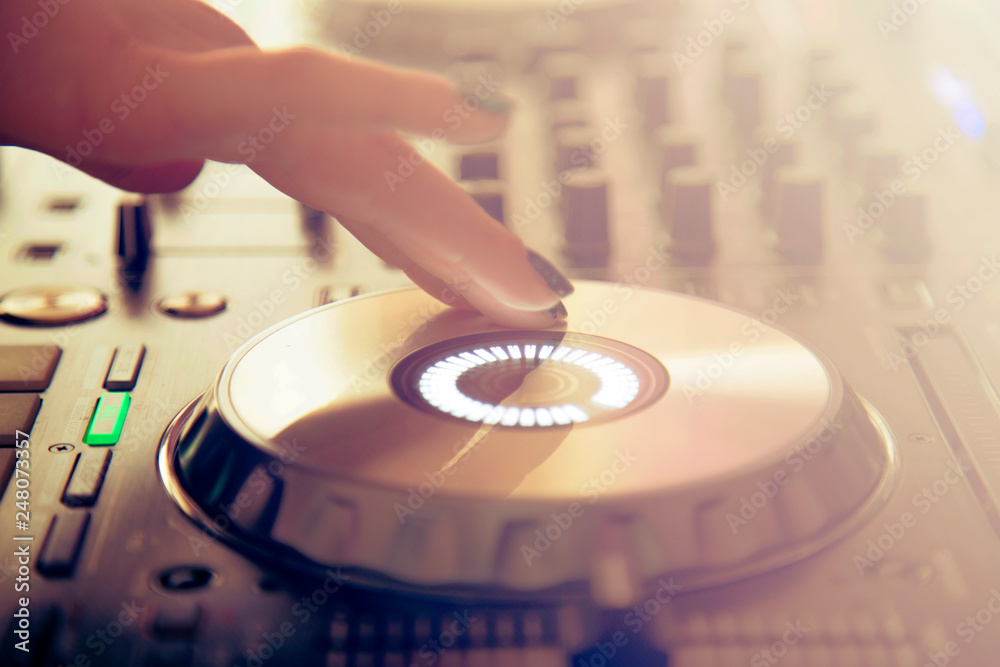 Obraz premium DJ Hand Mixing on Controller