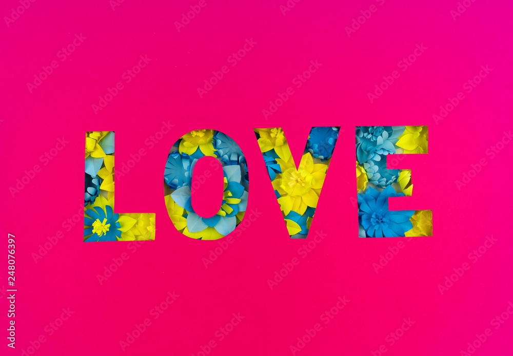Inscription Love cut out of paper, inside the flower made of paper. Pink background. Inscription Love cut out of paper, inside the flower made of paper. Pink background.