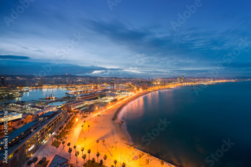 Aerial view of Barcelona Beach in summer night along seaside in Barcelona, Spain. Mediterranean Sea in Spain.