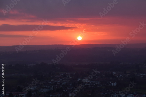 fiery sunset fiery sunset against the background of a provincial Italian town