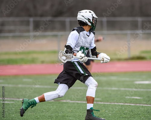 Принти на полотні Young athletes making amazing plays while playing Lacrosse