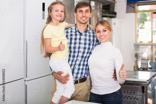 Family in store with electronics