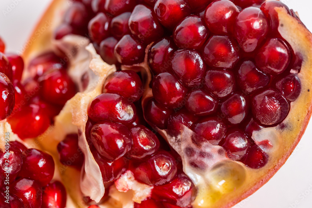 open pomegranate on a white background open pomegranate on a white background
