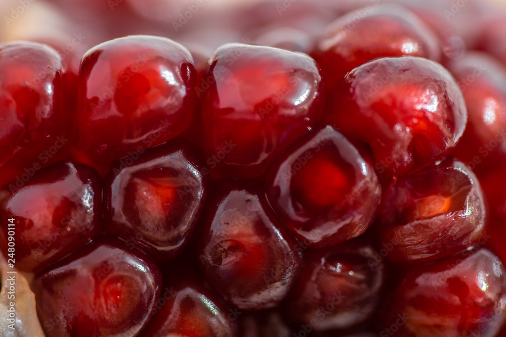 open pomegranate on a white background open pomegranate on a white background