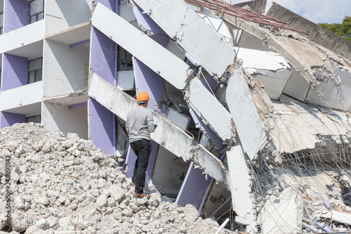 Engineer architect and worker operation control demolish old building.