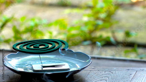 TOKYO,  JAPAN : Burning green MOSQUITO COIL in Japanese house in summer season. photo