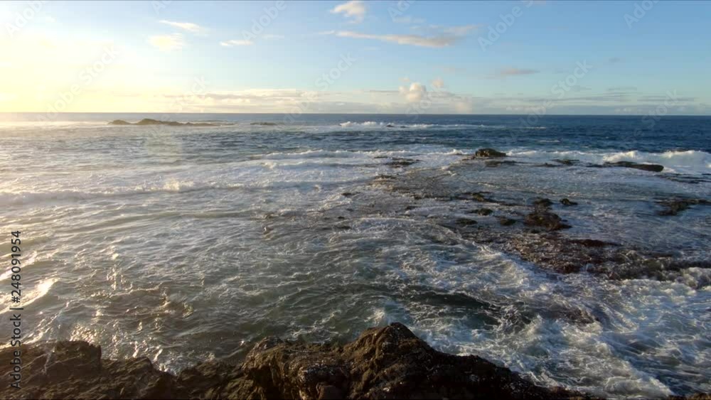 Afternoon view of the high cliffs and ocean at the Punta de Jandia, on the island of Fuerteventura, Canary Islands, Spain, Europe. Afternoon view of the high cliffs and ocean at the Punta de Jandia, on the island of Fuerteventura, Canary Islands, Spain, Europe.