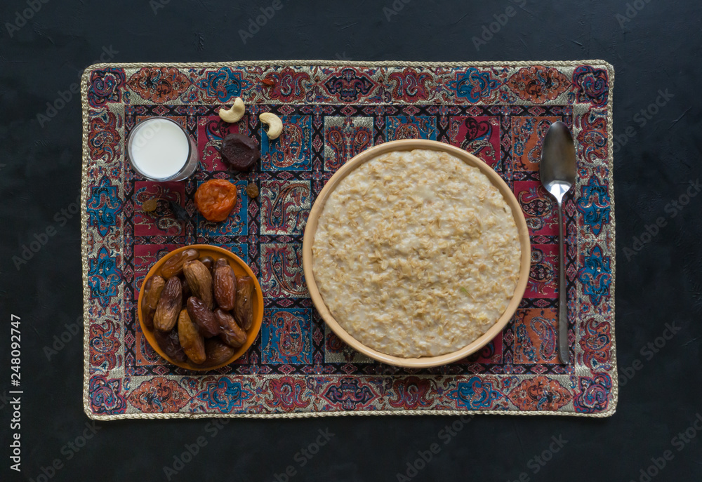 Oatmeal with dates and milk. Ramadan food. 
