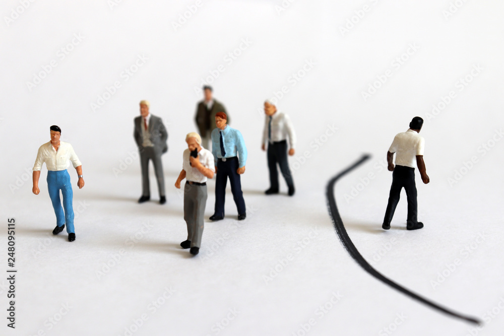 The concept of racial discrimination in society. Miniature people. The concept of racial discrimination in society. Miniature people.