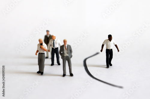 The concept of racism. Miniature people. 